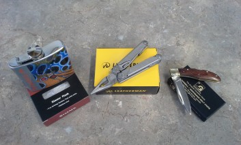 Left to right: Simms Trout Flask $40.00, The Leatherman Wave $120.00, Grohman R340S Lock Blade.